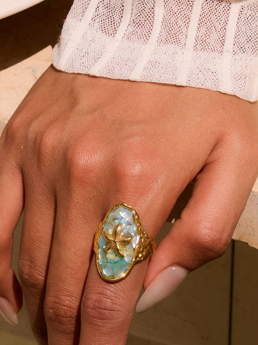 18K gold plated starfish ring with iridescent resin inlay. Unique ocean design with shimmer. Perfect statement ring for beach lovers.