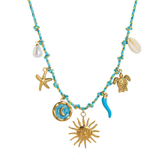 Necklace with gold charms including a sun, turtle, and starfish on a blue and gold rope.